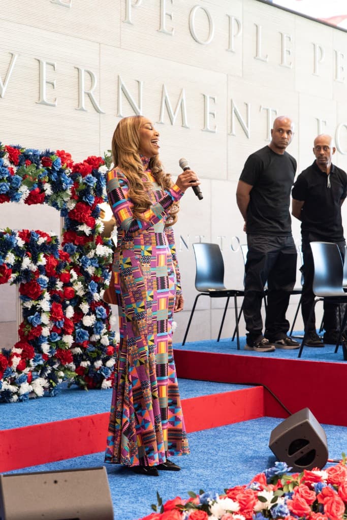 Felicia D. Williams speaking on stage at a civic celebration